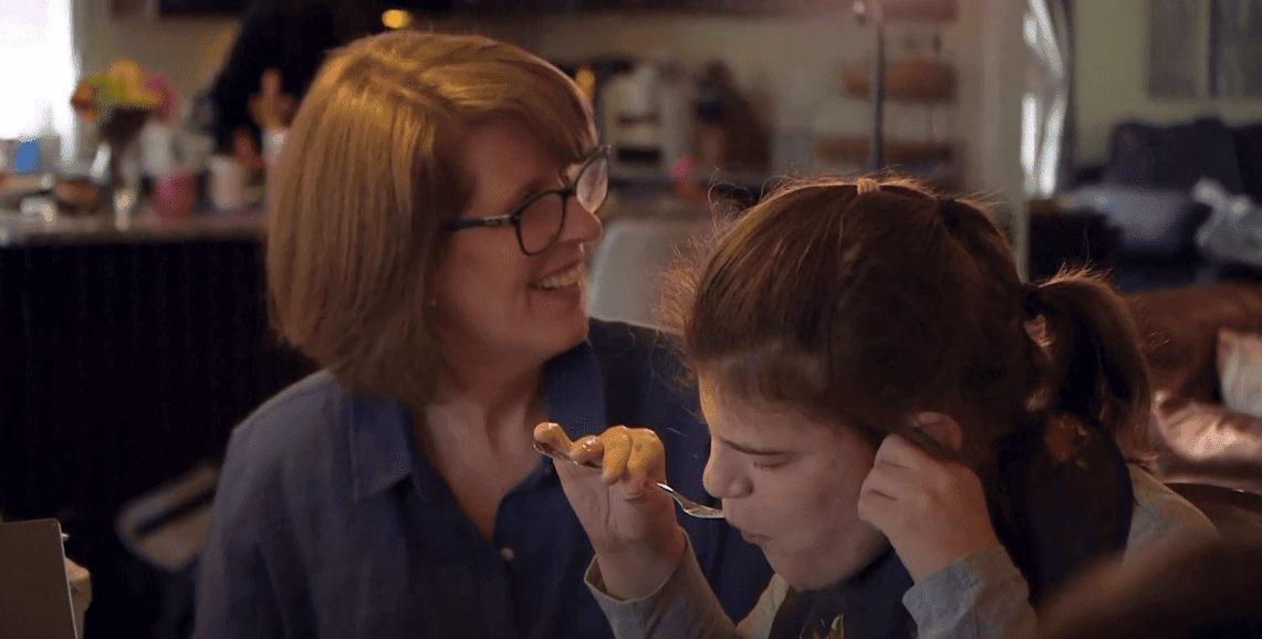 Parent and child sharing a meal